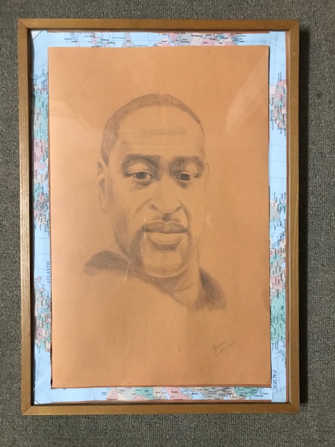 21.	George Floyd with USA map as border by Theresa Reuter, Baltimore artist.  Pencil on paper, wooden frame 15”x23”.  Original condition.  Starting bid $100 Increase by $5.