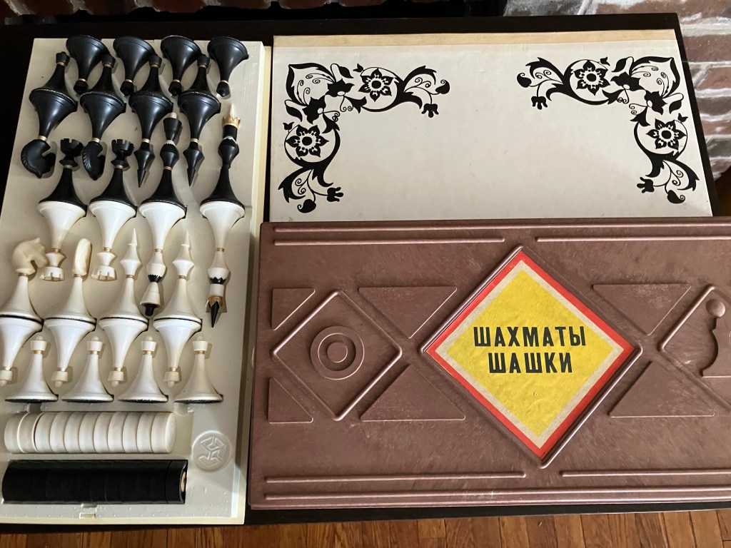 24.	Soviet Chess/checkers set. Plastic pieces, one checker missing.  15”x15” board. Pieces 2”-3” tall.  Good condition. Starting bid $95 Increase by $5.