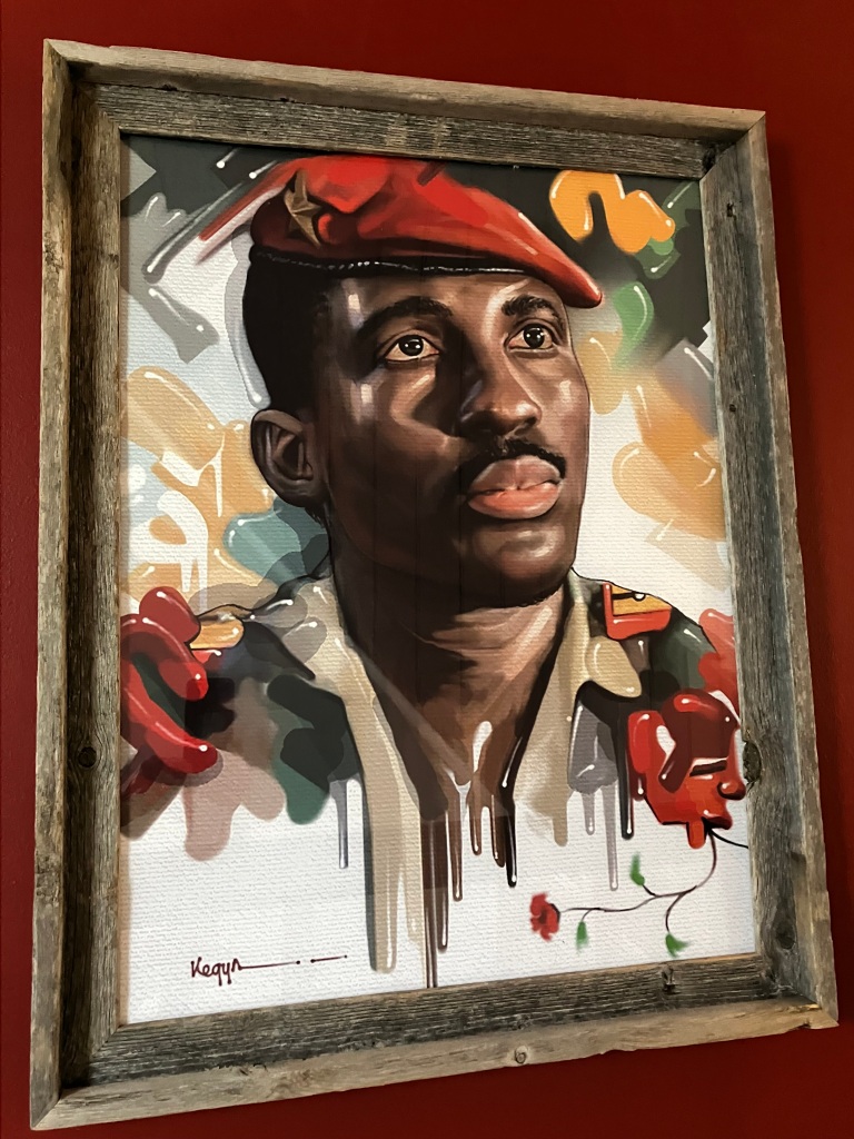 27.	Thomas Sankara portrait print, frame 21”x28”.  Mint Condition.  Starting bid $50 Increase by $5